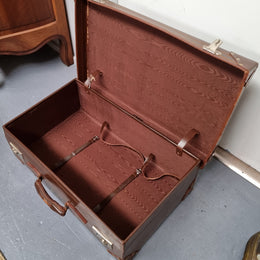 Impressive solid leather suitcase, moire fabric lined with leather straps to hold contents. Displays gold initials F.S.A near handle. With key. Please view photos as they help form part of the description.