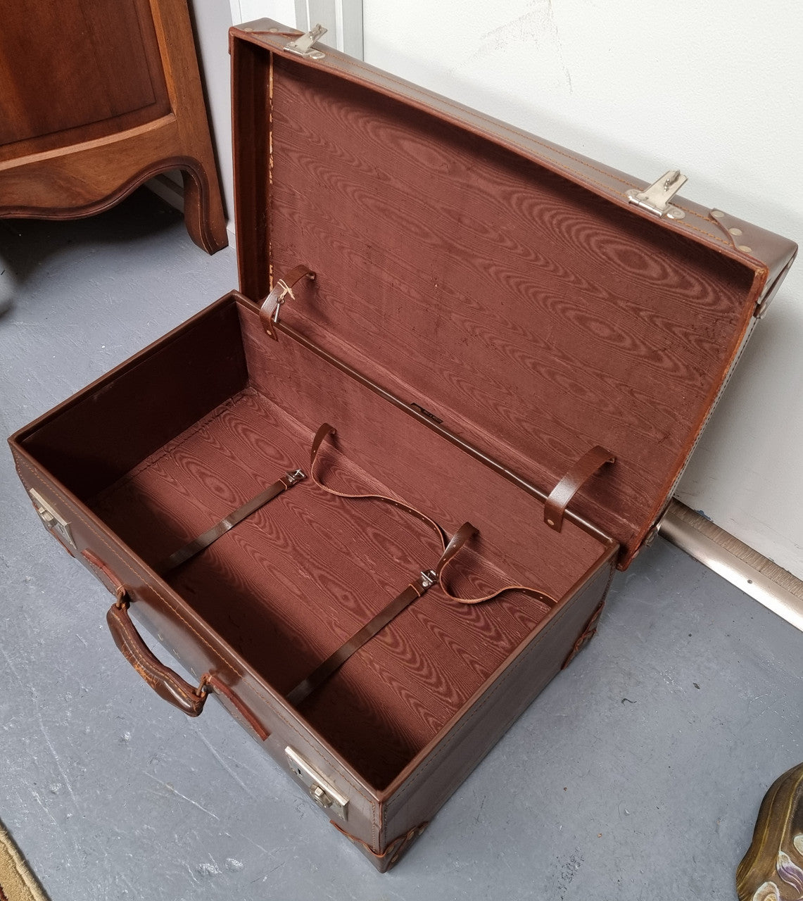 Impressive solid leather suitcase, moire fabric lined with leather straps to hold contents. Displays gold initials F.S.A near handle. With key. Please view photos as they help form part of the description.