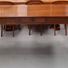 Antique French Oak Farmhouse table in fully restored condition. Features a single drawer and tapered legs.