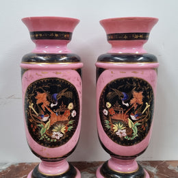 Late Victorian pink and hand painted, enameled pair of vases with some ware to enameling. It is in good original condition.