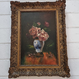 Stunning French signed floral oil on canvas painting of roses in a beautiful decorative frame and in good condition.