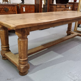 French Oak stretcher base farmhouse table with solid turned legs. It is in good original condition.