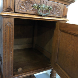 Pair of French Oak Arts and Crafts bedsides cabinets with lovely Carrara marble top and drawer and cupboard for storage. In good original detailed condition.