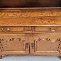 Charming 18th Century French Oak Vaisselier / kitchen dresser with two cupboard doors and three open shelves at the top. Sourced from France and in good original detailed condition.