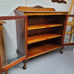 Chippendale style Mahogany two door bookcase. It has bevelled glass doors and two adjustable shelves. It has been sourced locally and is in good original detailed condition.