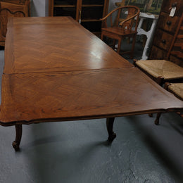 French Oak Louis XV style parquetry top extension table. It can sit six people when not extended and eight when fully extended. It has been sourced from France and is in original detailed condition.