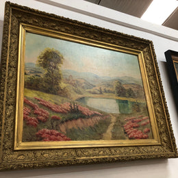 Beautiful French country scene oil on canvas in a lovely decorative frame in good original condition..