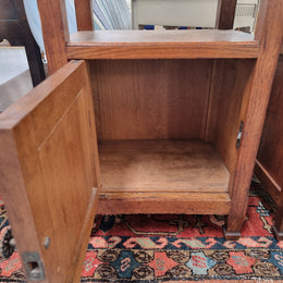 Charming pair of French Oak Arts and Crafts bedsides with shelf, cupboard with carving and marble top.  They have been sourced from France and are in good original detailed condition.