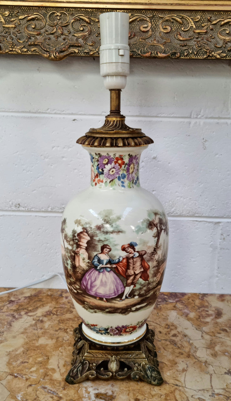 Beautiful French ceramic hand painted and transferred decorative table lamp. It has a lovely gilt bronze base and in good working order.