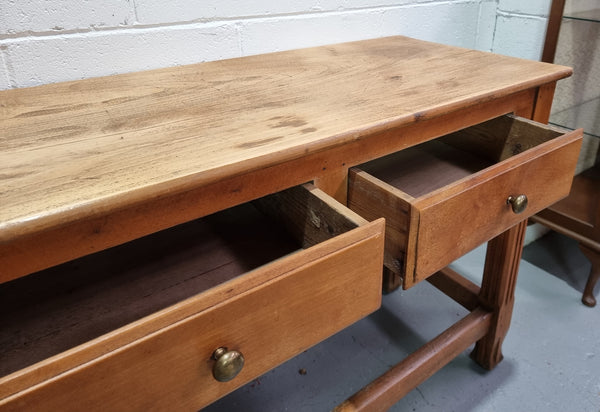 Late 19th Century Cherrywood console table with three drawers. In good used, detailed rustic condition.