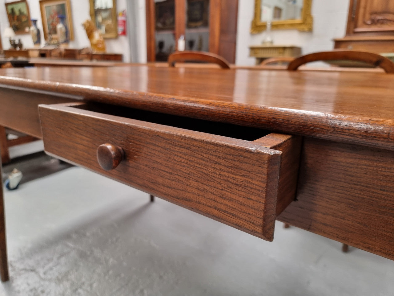 Antique French Oak Farmhouse table in fully restored condition. Features a single drawer and tapered legs.