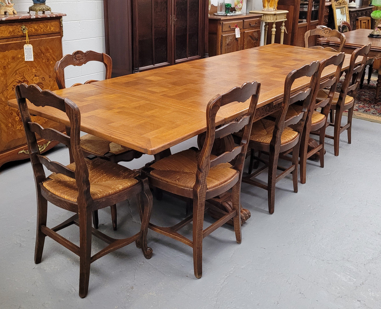 Amazing French Oak Renaissance style parquetry top extension table. Beautiful parquetry top and amazing detailed carvings on the legs. It extends to 306 cm long when fully extended. Sourced from France and in good original detailed condition.