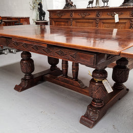 Renaissance style Oak extension table with parquetry top and twin pedestal base. The table extends by pulling out an extension leaf either side making it 287 cm long. Sourced from France and in good original detailed condition.