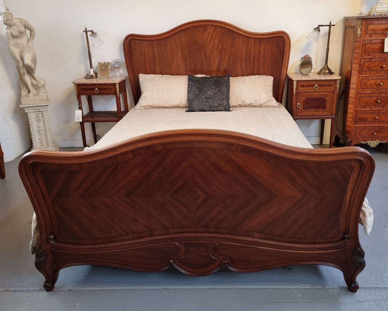 Beautiful French Walnut Louis XV style queen size bed with carving on the feet and in good original detailed condition.