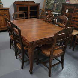 French Oak Louis XV style parquetry top extension table. It can sit six people when not extended and eight when fully extended. It has been sourced from France and is in original detailed condition.