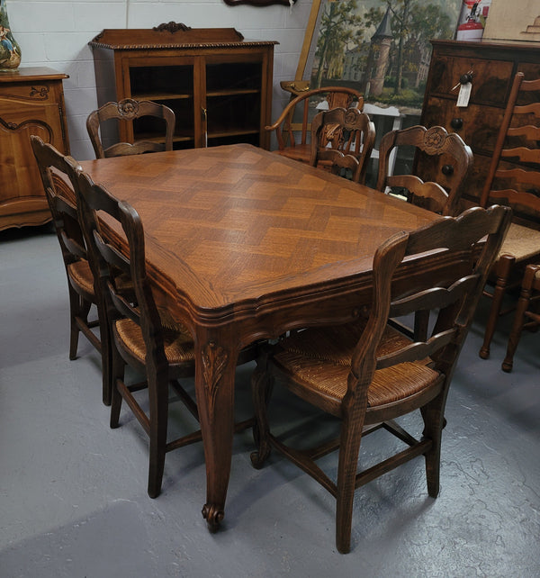 French Oak Louis XV style parquetry top extension table. It can sit six people when not extended and eight when fully extended. It has been sourced from France and is in original detailed condition.