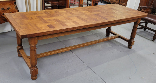 French Oak Refectory dining table with a parquetry top. Sourced from France this table comfortably sits eight to ten. It is in good original detailed condition.