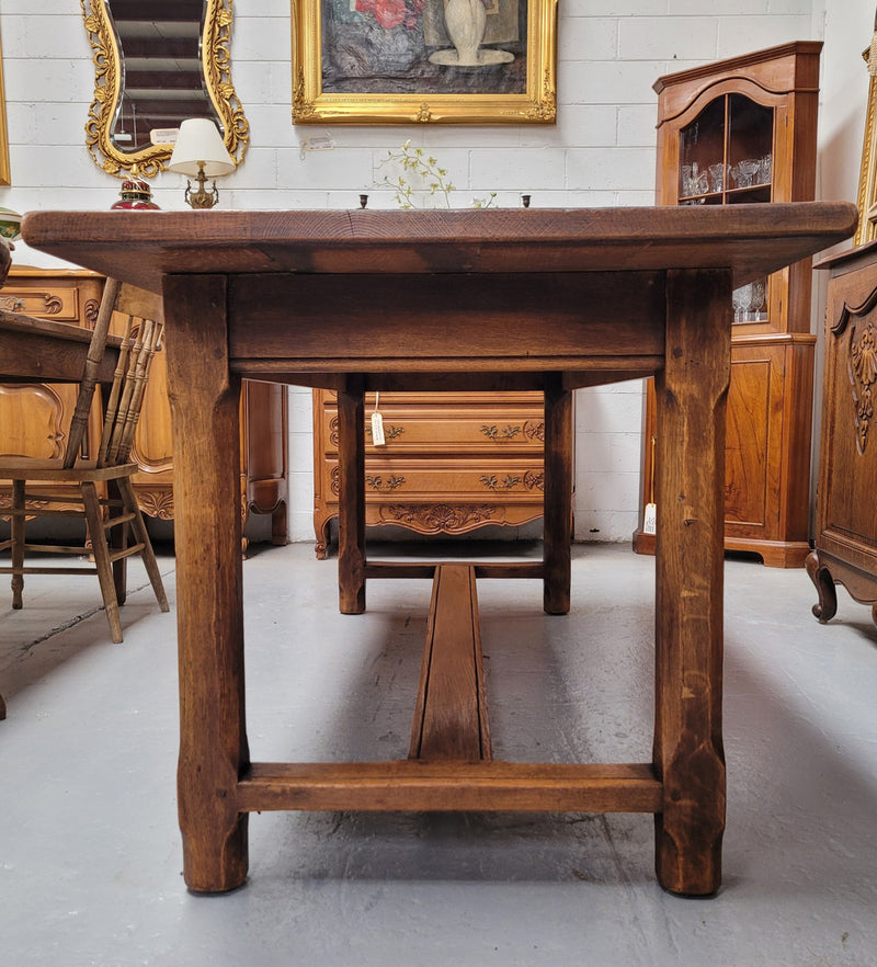 French oak stretcher base refectory table. It has been sourced from France and is in good original condition. Please see pictures to form part of the description.