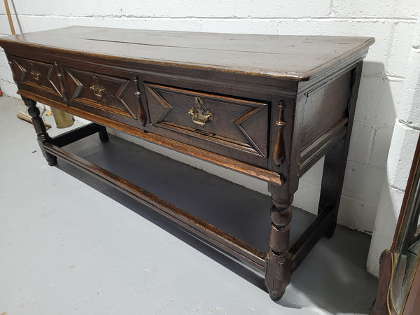 Early 19th Century Oak three drawer dresser Base in good original detailed condition commensurate with age.