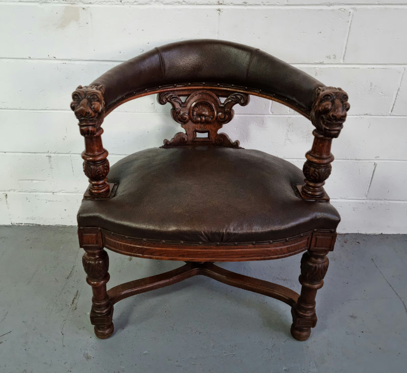 Henry 2nd style French Oak leather library chair with amazing detailed carvings. It is very comfortable to sit in and the leather is in good original condition.