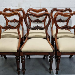 Set of six Victorian style balloon back chairs with lovely carved detail on legs and backs. Cream coloured upholstered seats and fabric is in good condition with some sign on use. Overall chairs are in good original detailed condition.