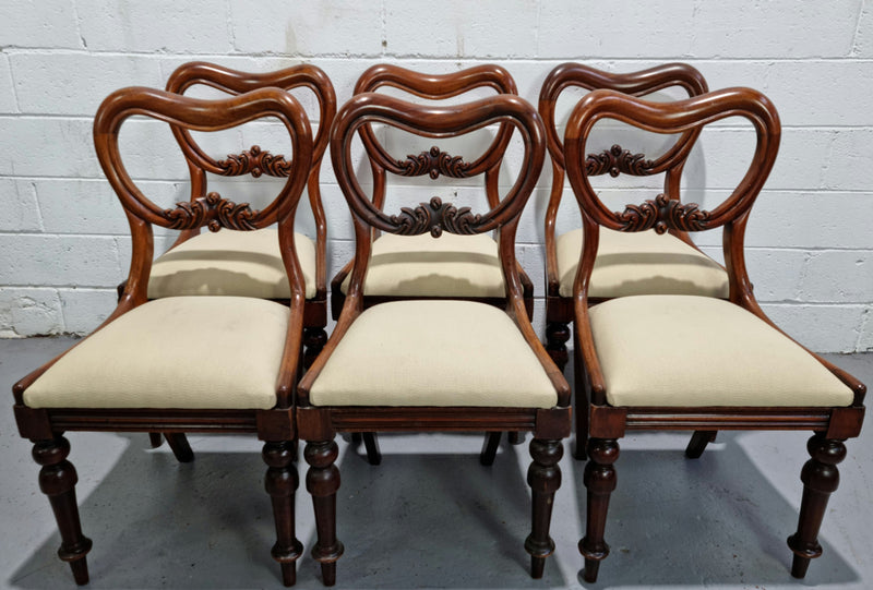 Set of six Victorian style balloon back chairs with lovely carved detail on legs and backs. Cream coloured upholstered seats and fabric is in good condition with some sign on use. Overall chairs are in good original detailed condition.