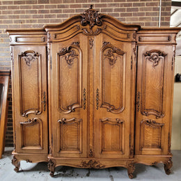 Amazing French Oak Louis XV style four door armoire. Plenty of storage space and beautifully carved throughout. In good original detailed condition and sourced from France. Please contact us for further photos.
