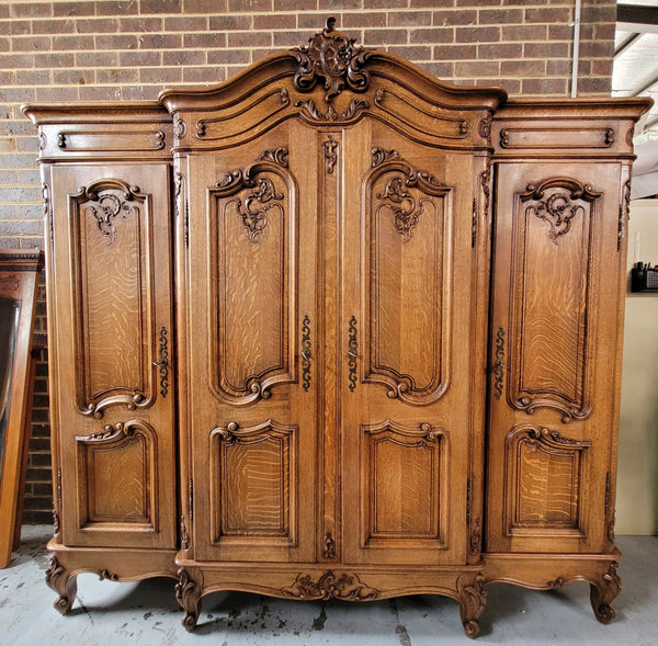 Amazing French Oak Louis XV style four door armoire. Plenty of storage space and beautifully carved throughout. In good original detailed condition and sourced from France. Please contact us for further photos.