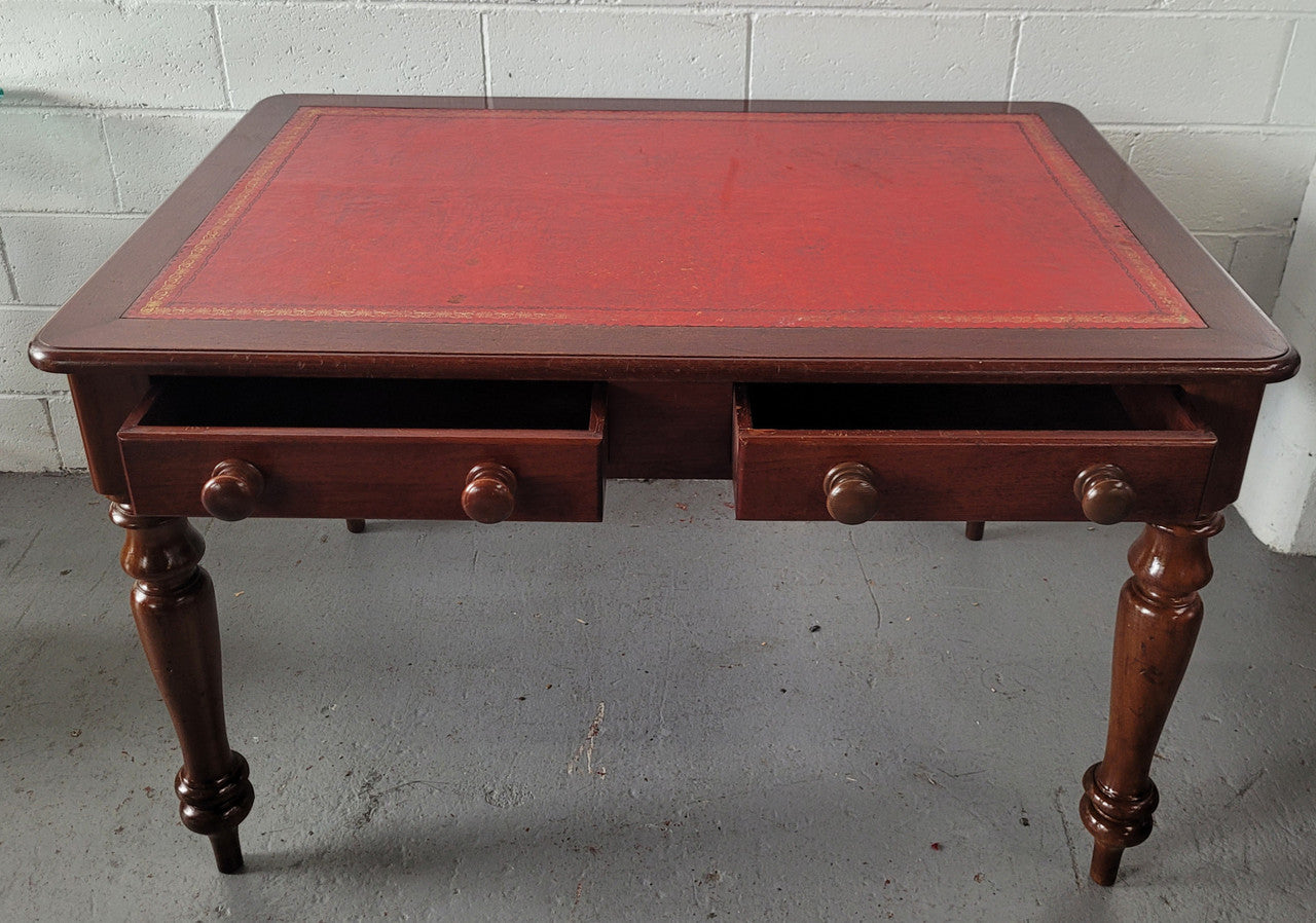 Victorian Cedar two drawer tooled leather topped desk with turned legs. In good original condition.