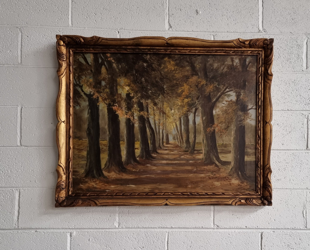 French signed oil on canvas depicting a charming landscape scene in a decorative gilt frame. It is in good original detailed condition and has been sourced from France.