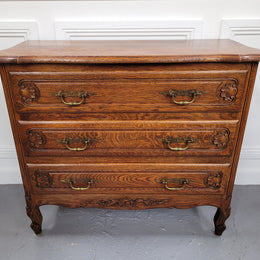 French Louis XV style Oak three drawer chest with wooden top. It has been sourced from France and is in good original detailed condition.