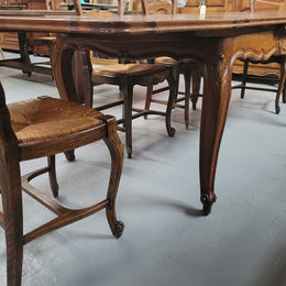 French Oak Louis XV style parquetry top extension table. It can sit six people when not extended and eight when fully extended. It has been sourced from France and is in original detailed condition.