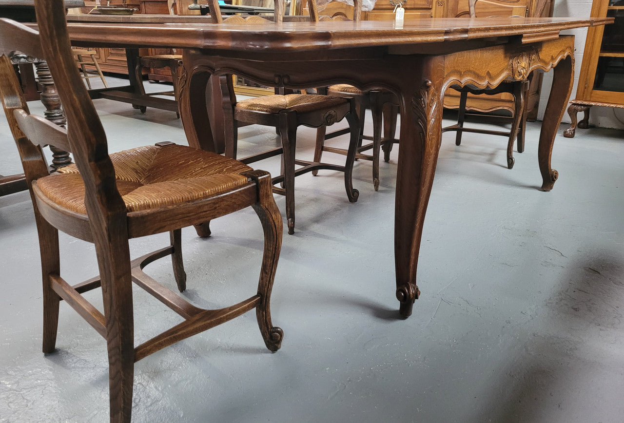 French Oak Louis XV style parquetry top extension table. It can sit six people when not extended and eight when fully extended. It has been sourced from France and is in original detailed condition.