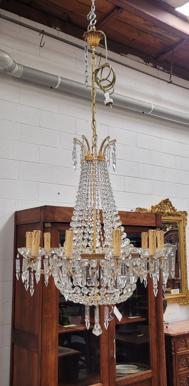 Fine French Empire basket shaped crystal chandelier. Consisting of ten exterior arms and four interior lights. It has stunning crystal's with prism drops. It has been sourced from France fully rewired to Australian standards.