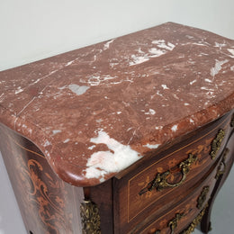 A stunning French petite two drawer inlaid Rosewood commode. In good original detailed condition.