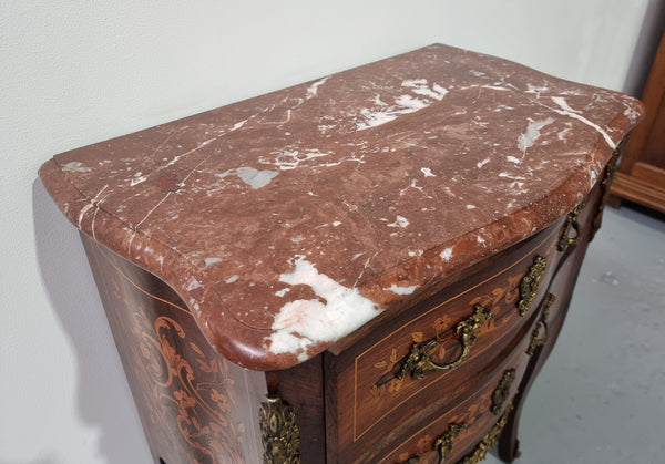 A stunning French petite two drawer inlaid Rosewood commode. In good original detailed condition.