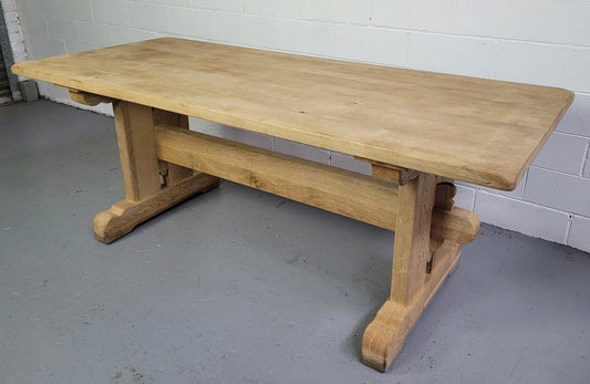 Late 19th century French stripped Oak double pedestal stretcher base Farmhouse table. Features raw wood that could be used as is for a distressed look, or finished and waxed for a more refined look.