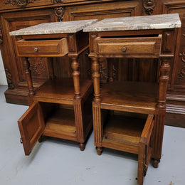 Pair of French Antique Oak marble top bedsides Henry II style. They have a drawer, cupboard and an open shelf for all your storage needs. They have been sourced from France and are in good original detailed condition.