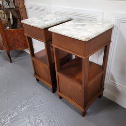 Pair of Antique French Oak Louis XVI style marble top bedside cabinets. They have decorative inlay and have been sourced from France. They are in good original detailed condition.