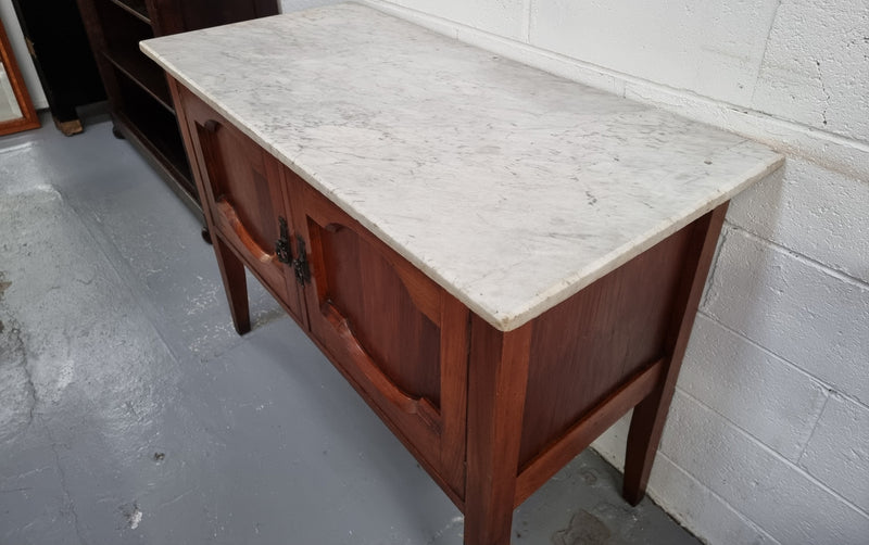 Blackwood two door white marble top cabinet. This would be ideal to be used as an entertainment unit, a TV stand or TV cabinet. In good original condition.