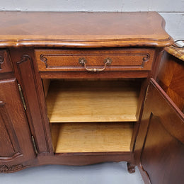 French Oak Louis XV style three drawer three door parquetry top sideboard. It has been sourced from France and is in good original detailed condition.