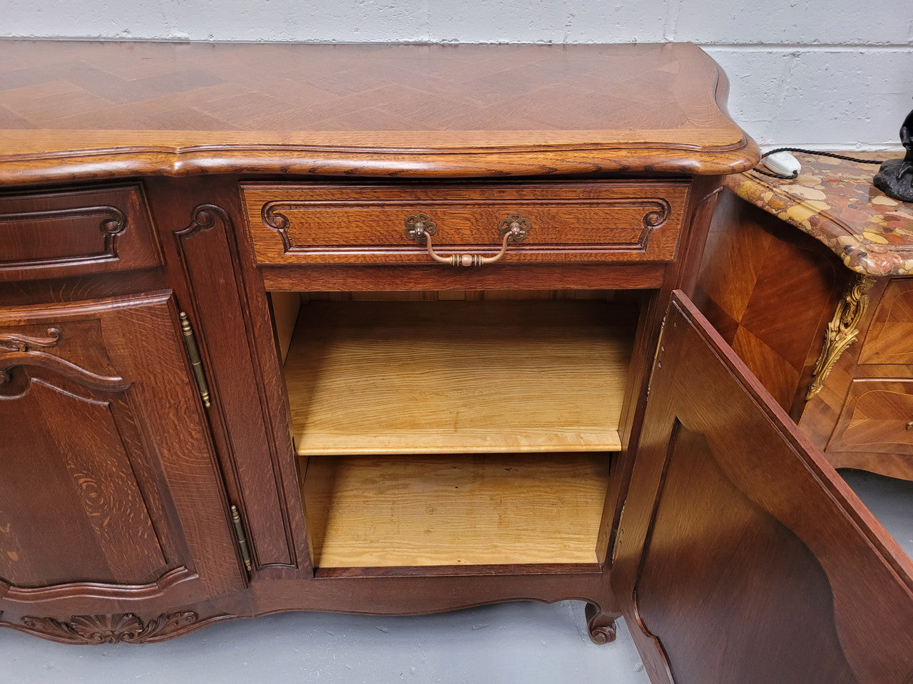 French Oak Louis XV style three drawer three door parquetry top sideboard. It has been sourced from France and is in good original detailed condition.