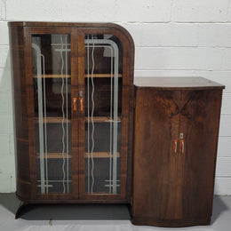 Art Deco Walnut display / drinks cabinet consisting of two glass door display and two door cupboard. Top section also lifts up and turns into a drinks area. All with original handles and in good original detailed condition.