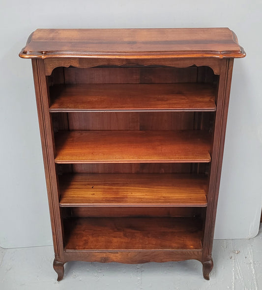 Compact French Louis XV Style Walnut four shelf open bookcase. In good original detailed condition.