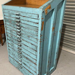 Fabulous set of vintage painted blue printers drawers that have adjustable separators which can be taken out for large papers. The drawers are various sizes and there is a section on top for working on or for storing brushes or tall items . These would be perfect for artists or jewellery pieces or even architects. Such a beautiful piece of industrial furniture.