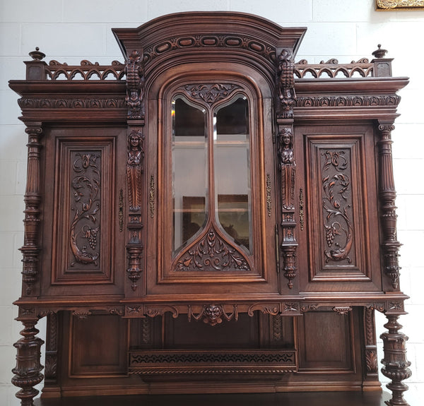 Spectacular French Walnut Renaissance Style buffet with amazing detailed carvings. Plenty of storage space with five cupboards and two large drawers. The three top cupboards open up to two adjustable shelves in each section and the two bottom drawers open up to one large fully adjustable shelve. In good original detailed condition.