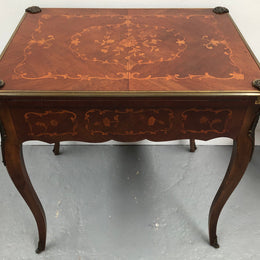 Beautiful french inlaid games table which includes internal drawers and bronze mounts. Internal drawers have counters and cards included.