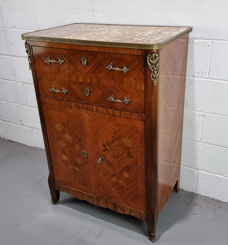 Lovely French Louis XV style Mahogany marquetry inlaid two door side cabinet. It has a beautiful coloured brass bound marble top in good original detailed condition.