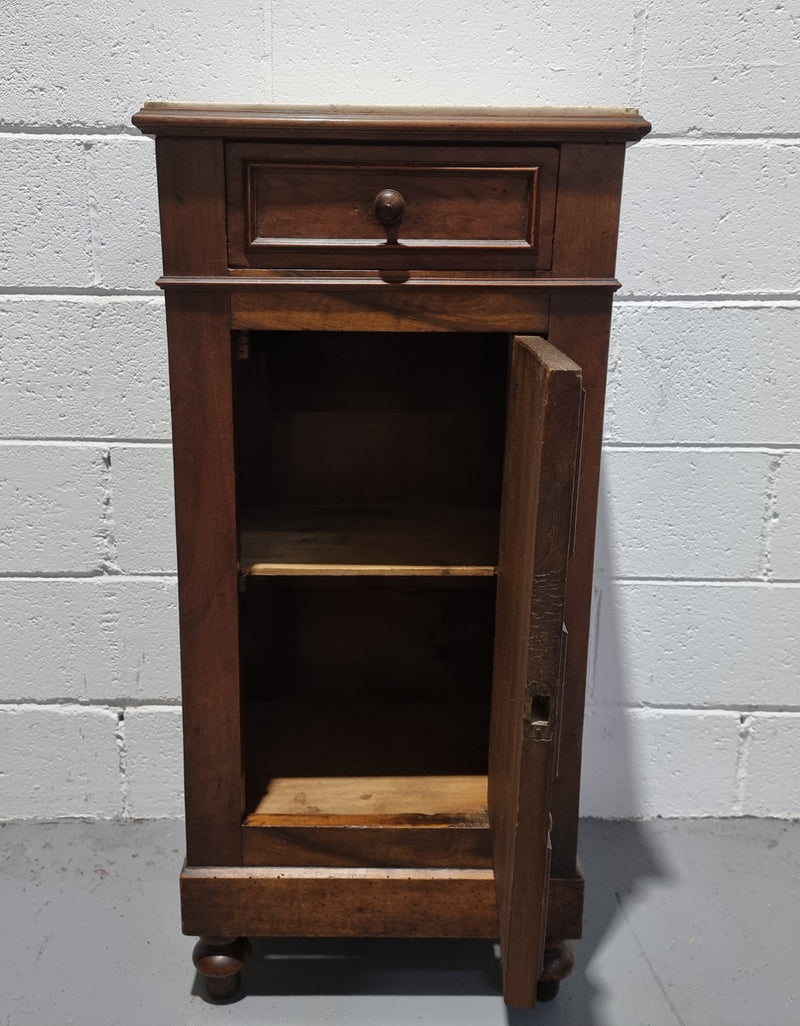 French Walnut bedside/occasional cabinet with one drawer and a cupboard and marble top in good original condition.