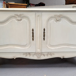 Louis XV style chalk painted two door cabinet which would also make an ideal TV cabinet. It has been sourced from France and in good original detailed condition.
